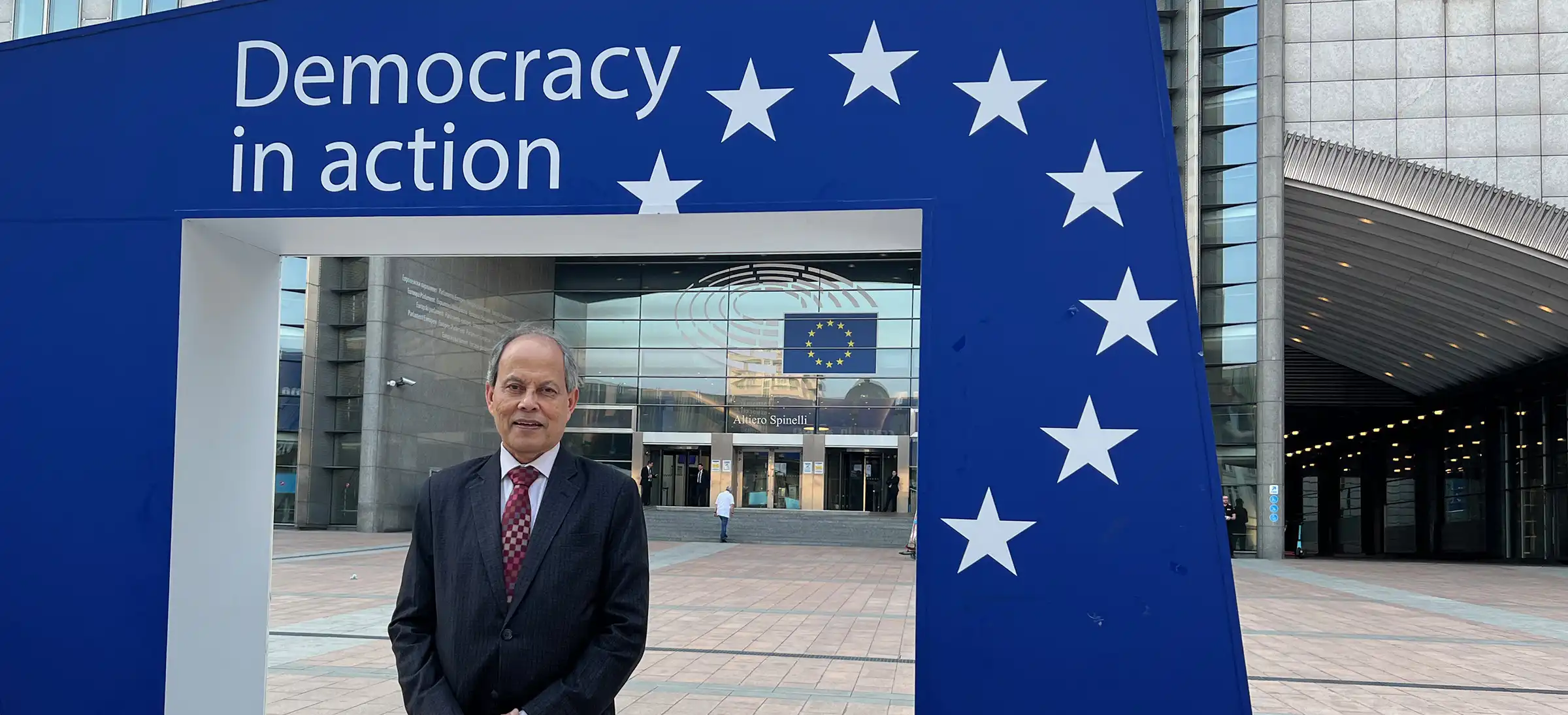 Saifur Rahman Outside European Parliament.webp