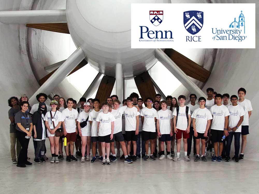 group of teenagers posing for a group photo in white t shirts in front of a jet engine propeller2.jpg