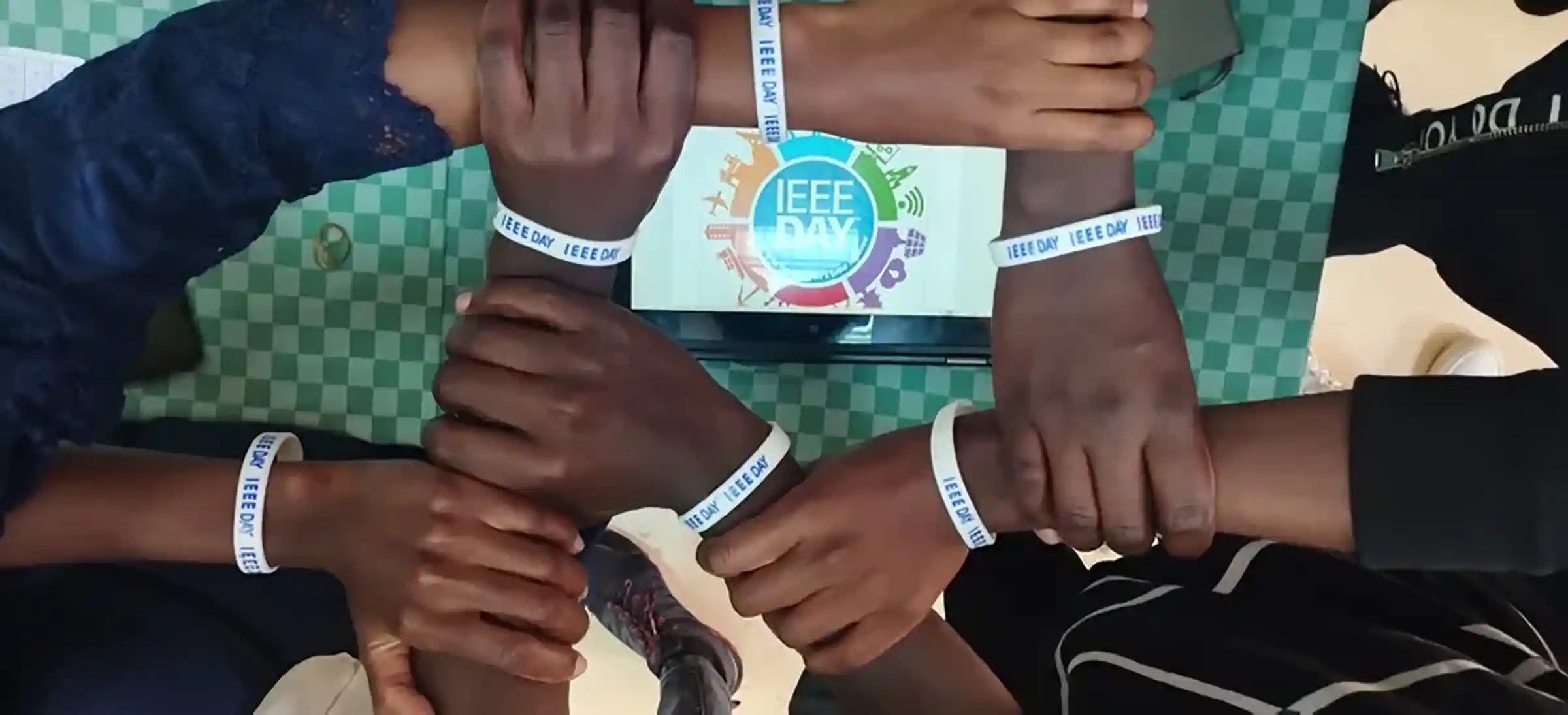 ieee day participants joining hands.webp